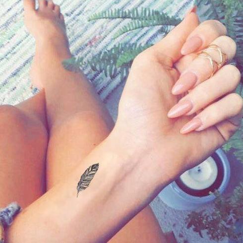 native feather tattoos on wrist