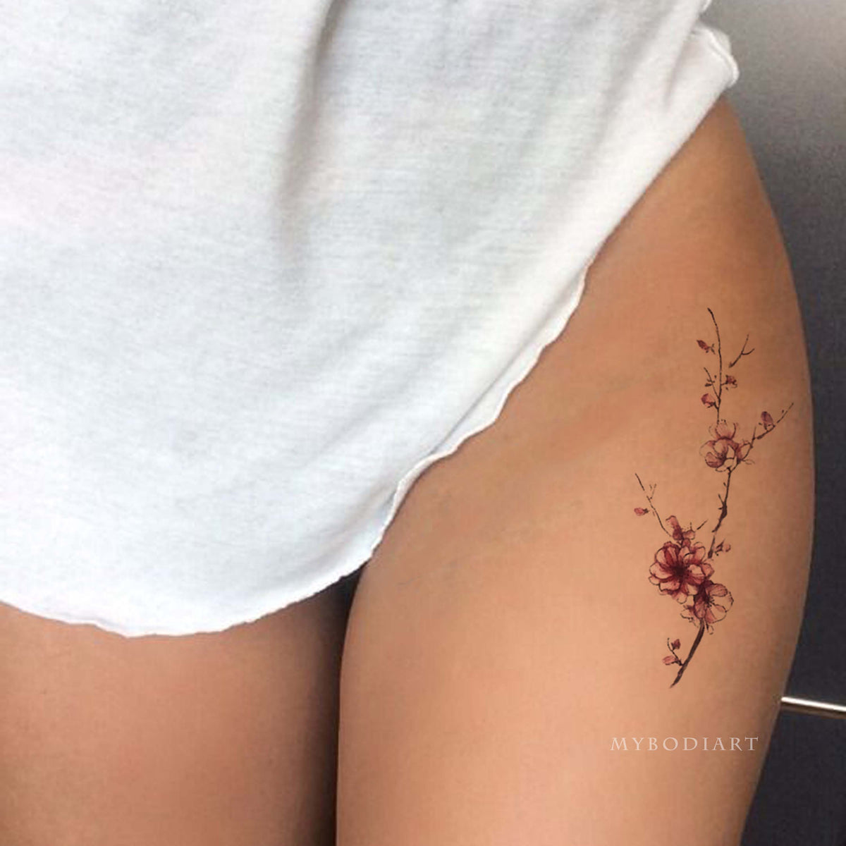 cherry blossom tattoo black and white thigh
